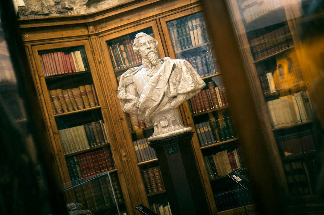 Old library shelves filled with historical books