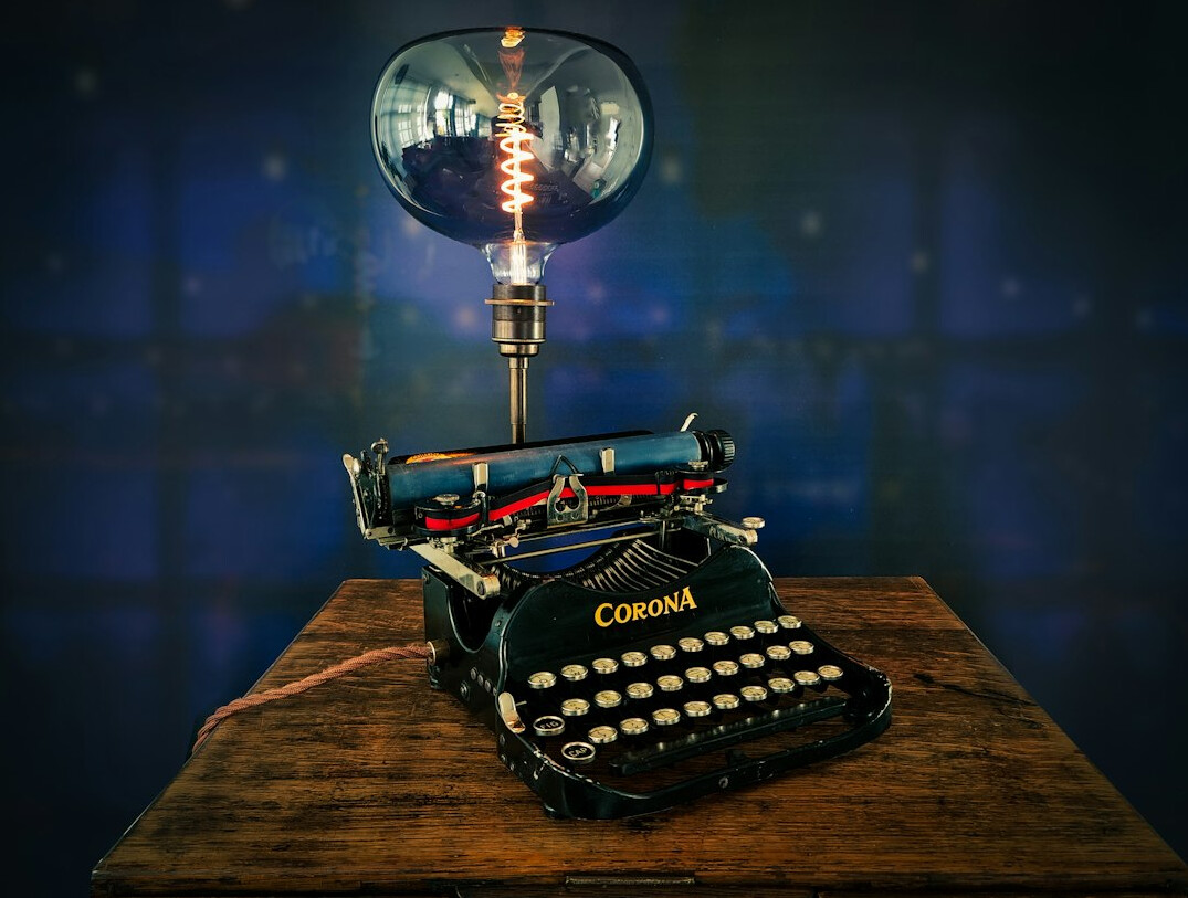 Vintage typewriter with paper on a wooden desk